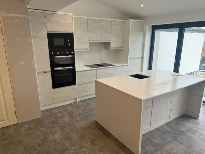 Concrete-effect handleless – kitchen fitted by Cash and Carry Kitchens, Blackpool